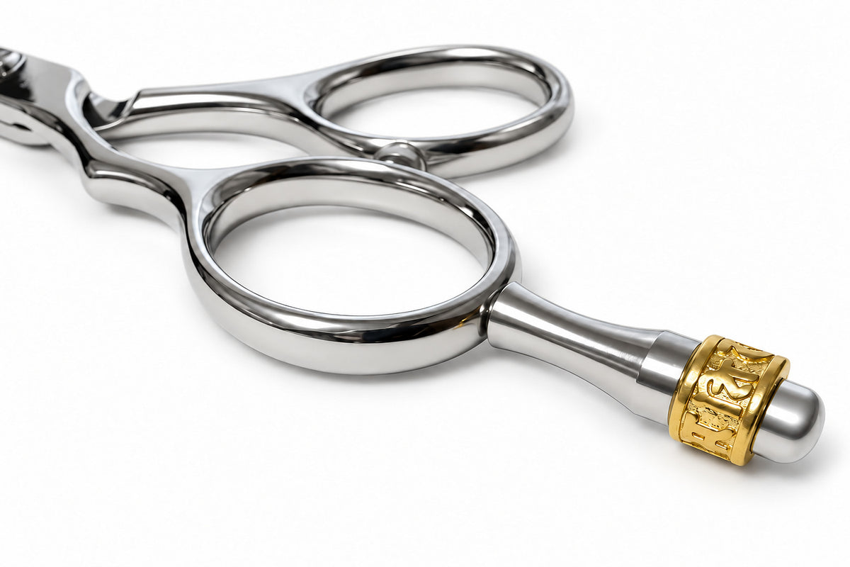 Left-handed Ichiro Crown thinning shear handle with its gold-tone crown finger rest